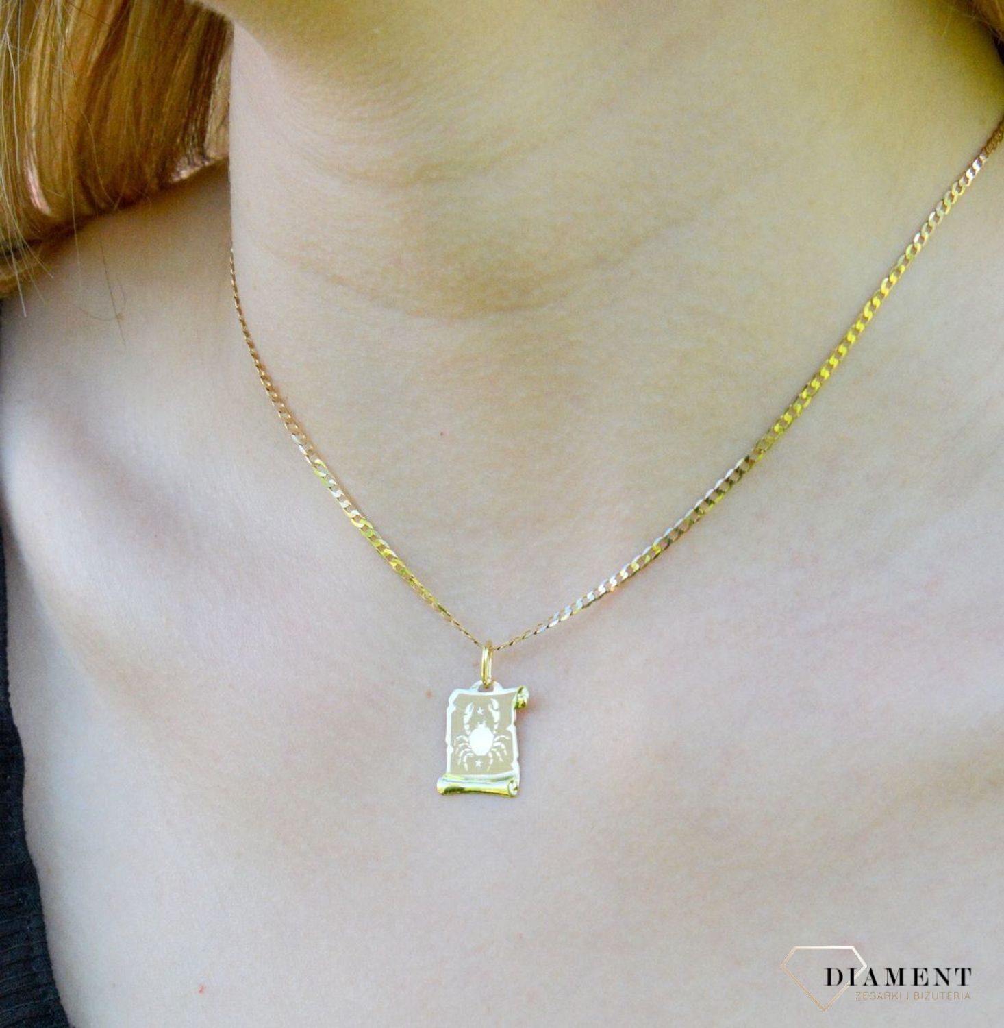 Złota zawieszka 585 znak zodiaku Rak ZA 3054I.  Zawieszka została wykonana ze złota próby 585.Zawieszka będzie pięknym prezentem dla bliskiej osoby spod znaku raka. W naszej ofercie dostępne są także naszyjniki i zawieszki z s.jpg